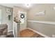 Welcoming foyer features neutral walls, tile flooring, and a decorative wreath on the front door at 9265 Brunson Run, Indianapolis, IN 46256