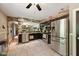 Spacious kitchen with dark cabinets, stone archway, stainless steel appliances, and tile floors at 9265 Brunson Run, Indianapolis, IN 46256