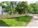 Large backyard with a new wooden fence and a detached garage at 946 N Temple Ave, Indianapolis, IN 46201