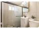 Updated bathroom with tiled shower, modern vanity, and stylish fixtures at 946 N Temple Ave, Indianapolis, IN 46201
