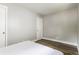 Minimalist bedroom design with neutral tones, wood flooring and ample closet space at 946 N Temple Ave, Indianapolis, IN 46201