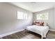 Cozy bedroom with natural light, hardwood floors and neutral decor at 946 N Temple Ave, Indianapolis, IN 46201
