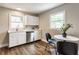 Charming kitchen features white cabinets, stainless appliances, and a dedicated eating area at 946 N Temple Ave, Indianapolis, IN 46201