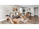 Bright living room features a comfy sofa, stylish decor, accent chairs, and plank flooring at 946 N Temple Ave, Indianapolis, IN 46201
