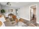 Bright living room features a comfy sofa, stylish decor, accent chairs, and plank flooring at 946 N Temple Ave, Indianapolis, IN 46201