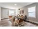 Open living room boasts with a modern style, decor, and plank flooring at 946 N Temple Ave, Indianapolis, IN 46201