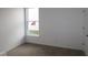Neutral bedroom with carpet and a large window, perfect for personalization at 10604 Maidenhair Dr, Indianapolis, IN 46239