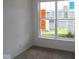 Bedroom with neutral carpet, white walls, and a bright window with outside views at 10604 Maidenhair Dr, Indianapolis, IN 46239
