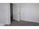Neutral bedroom with white trim features double doors and plush carpet at 10604 Maidenhair Dr, Indianapolis, IN 46239