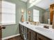 Bathroom showcasing a double sink vanity with a white countertop and traditional cabinets at 1067 Barley Cir, Carmel, IN 46032