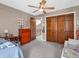 Comfortable bedroom featuring neutral carpet, wood dresser, and a double bed at 1067 Barley Cir, Carmel, IN 46032