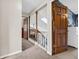 Bright hallway featuring carpeted floors, white walls, and a wooden staircase with skylights at 1067 Barley Cir, Carmel, IN 46032