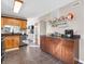 Open kitchen with granite countertops and dark wood cabinets at 1067 Barley Cir, Carmel, IN 46032