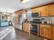 Well-lit kitchen with stainless steel appliances and custom wood cabinetry at 1067 Barley Cir, Carmel, IN 46032