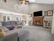 Spacious living room with vaulted ceilings, a cozy fireplace, and modern decor and lots of natural light at 1067 Barley Cir, Carmel, IN 46032