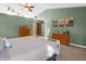 Bright primary bedroom with skylights, a ceiling fan, and multiple dressers at 1067 Barley Cir, Carmel, IN 46032