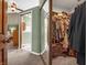 Spacious walk-in closet with shelving, clothing racks, and mirrored doors at 1067 Barley Cir, Carmel, IN 46032