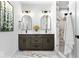 Modern bathroom with dual sinks, elegant mirrors, and a stylish marble-tiled shower at 1100 English Ave, Indianapolis, IN 46203