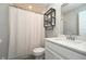 Modern bathroom featuring a vanity with a quartz countertop and a shower with white tile at 11663 Winnower, Noblesville, IN 46060