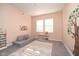 bedroom with a playful rug and ample natural light from the two windows at 11663 Winnower, Noblesville, IN 46060
