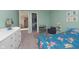 bedroom with Paw Patrol bedding, blue-green walls, and playful decor creating a fun and inviting space at 11663 Winnower, Noblesville, IN 46060