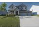 Charming two-story home featuring a well-manicured lawn and a spacious two-car garage at 11663 Winnower, Noblesville, IN 46060