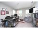 Home office with desk, bean bag chair, windows, and neutral walls, creating a functional and comfortable workspace at 11663 Winnower, Noblesville, IN 46060