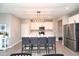 Bright kitchen with a center island, stainless steel appliances, and open access to other living areas at 11663 Winnower, Noblesville, IN 46060