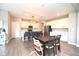 Bright, open kitchen featuring a large island, modern appliances, and stylish dining area at 11663 Winnower, Noblesville, IN 46060