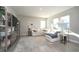 Bright living room featuring a plush white sectional and natural light from the windows at 11663 Winnower, Noblesville, IN 46060