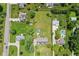 Aerial view of a home and its surrounding neighborhood, featuring a large, well-manicured lawn at 1439 E Mckenzie Rd, Greenfield, IN 46140