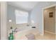 A relaxing bathroom features a large soaking tub with tile surround and step up at 1439 E Mckenzie Rd, Greenfield, IN 46140