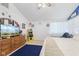 Bright bedroom with a vaulted ceiling, TV, and a vibrant blue carpet area at 1439 E Mckenzie Rd, Greenfield, IN 46140