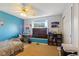 Bedroom with large window, ceiling fan, and built in desk at 1439 E Mckenzie Rd, Greenfield, IN 46140