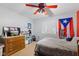 Bright bedroom featuring a ceiling fan, neutral walls and cozy carpet at 1439 E Mckenzie Rd, Greenfield, IN 46140