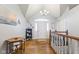 Inviting foyer with hardwood floors, light gray walls, and a vaulted ceiling at 1439 E Mckenzie Rd, Greenfield, IN 46140
