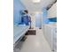 Bright laundry room with modern appliances, folding table and storage at 1439 E Mckenzie Rd, Greenfield, IN 46140