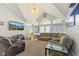Bright living room with vaulted ceilings, arched windows, and comfortable seating at 1439 E Mckenzie Rd, Greenfield, IN 46140