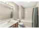 Tiled bathroom featuring a large soaking tub, vanity with sink, and chrome fixtures at 1540 Brook Pointe Dr, Indianapolis, IN 46234