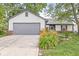 Charming single-story home featuring a well-maintained lawn and an attached two-car garage at 1540 Brook Pointe Dr, Indianapolis, IN 46234
