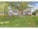 Charming front exterior featuring well-maintained lawn, garden bed and two car garage at 1540 Brook Pointe Dr, Indianapolis, IN 46234