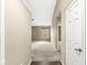 Neutral hallway leads to carpeted living space with natural light from a window at 1540 Brook Pointe Dr, Indianapolis, IN 46234