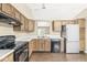 Traditional kitchen with wooden cabinets, white countertops and modern stainless steel refrigerator at 1540 Brook Pointe Dr, Indianapolis, IN 46234