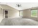 Spacious living room with large windows offering ample natural light and neutral carpet and paint at 1540 Brook Pointe Dr, Indianapolis, IN 46234