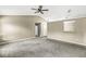 Neutral living room featuring vaulted ceilings and multiple access points at 1540 Brook Pointe Dr, Indianapolis, IN 46234