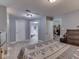 Spacious bedroom features wood floors and easy access to both the ensuite bathroom and kitchen at 1603 S Morgantown Rd, Greenwood, IN 46143