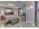 Cozy bedroom featuring light walls and flooring plus two windows for natural light at 1603 S Morgantown Rd, Greenwood, IN 46143