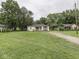 Expansive front lawn leads up to this charming single-story home with neutral siding at 1603 S Morgantown Rd, Greenwood, IN 46143