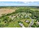 Aerial view of an estate featuring an in-ground pool and lush green landscaping at 1682 S Fox Cove Blvd, New Palestine, IN 46163