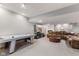 Finished basement with an air hockey table, media center, and plenty of space for entertainment at 1682 S Fox Cove Blvd, New Palestine, IN 46163